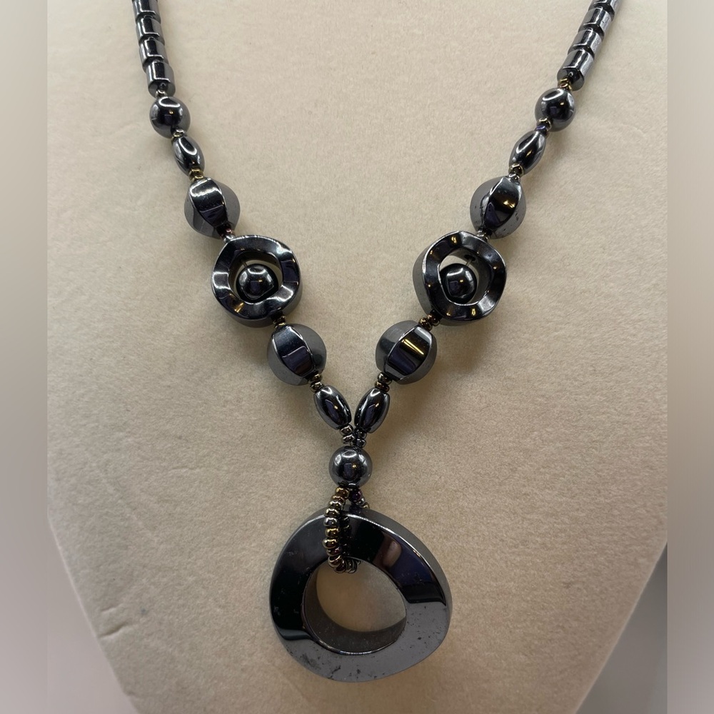 Hematite beaded necklace with open charm circle. 18 inches long.
